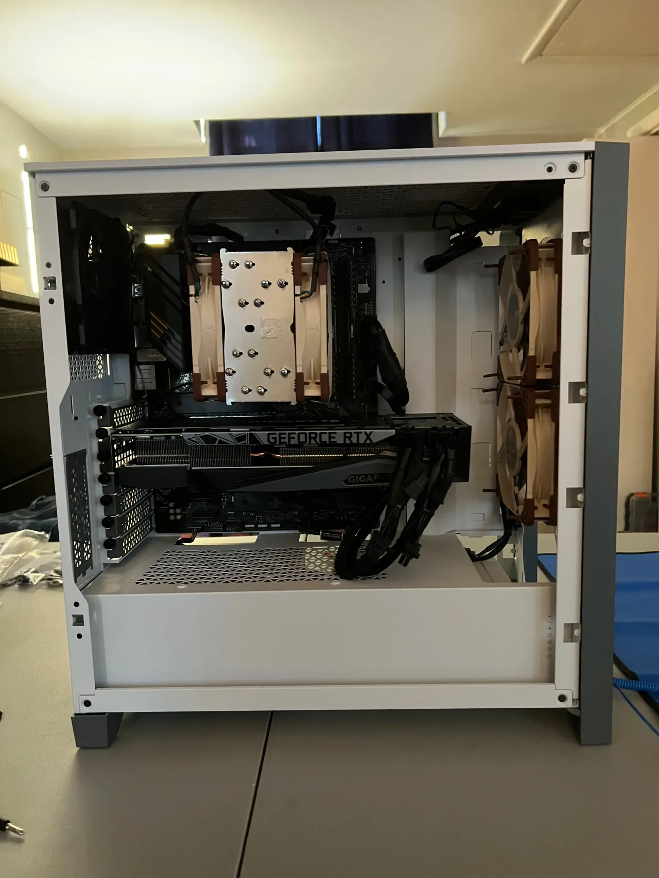 Interior of the custom production workstation PC, showing the graphics card, CPU cooler, and cabling.