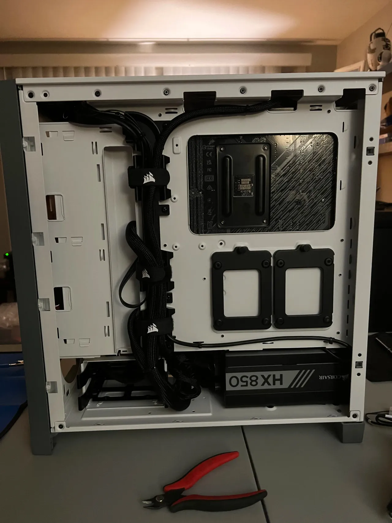 Rear of the production workstation PC case with routed cabling and power supply.