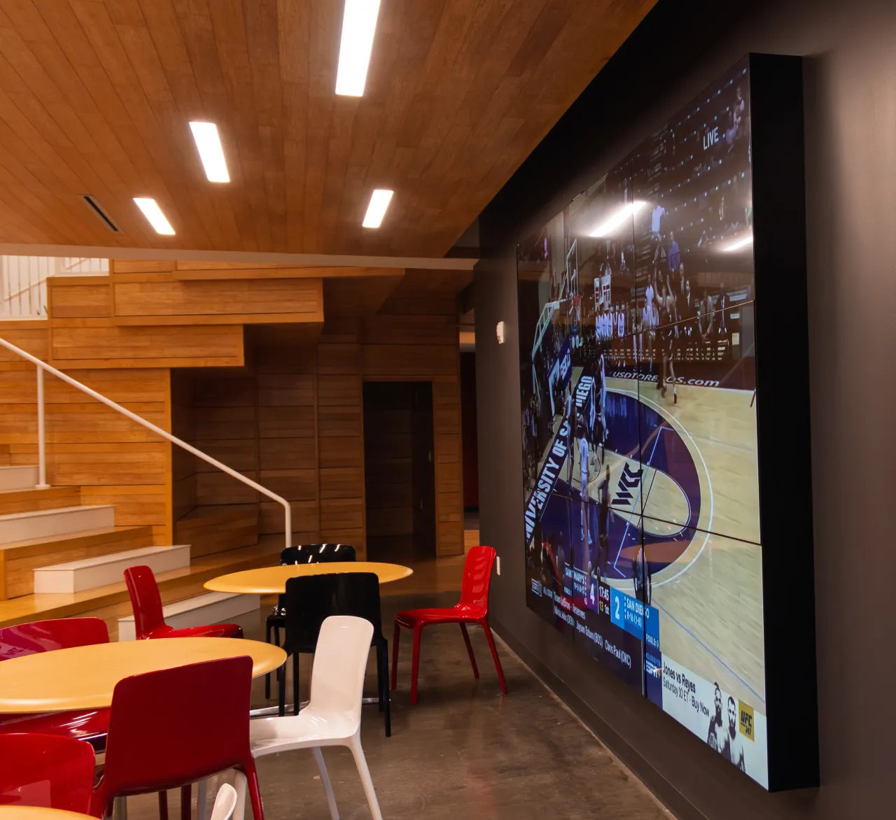 The Living Room lounge at SESAC with lounge seating and floor-to-ceiling windows.