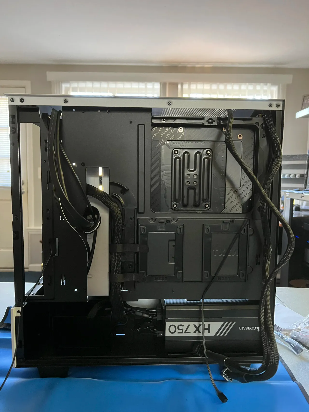 Rear of the production workstation PC case with cable management and power supply.